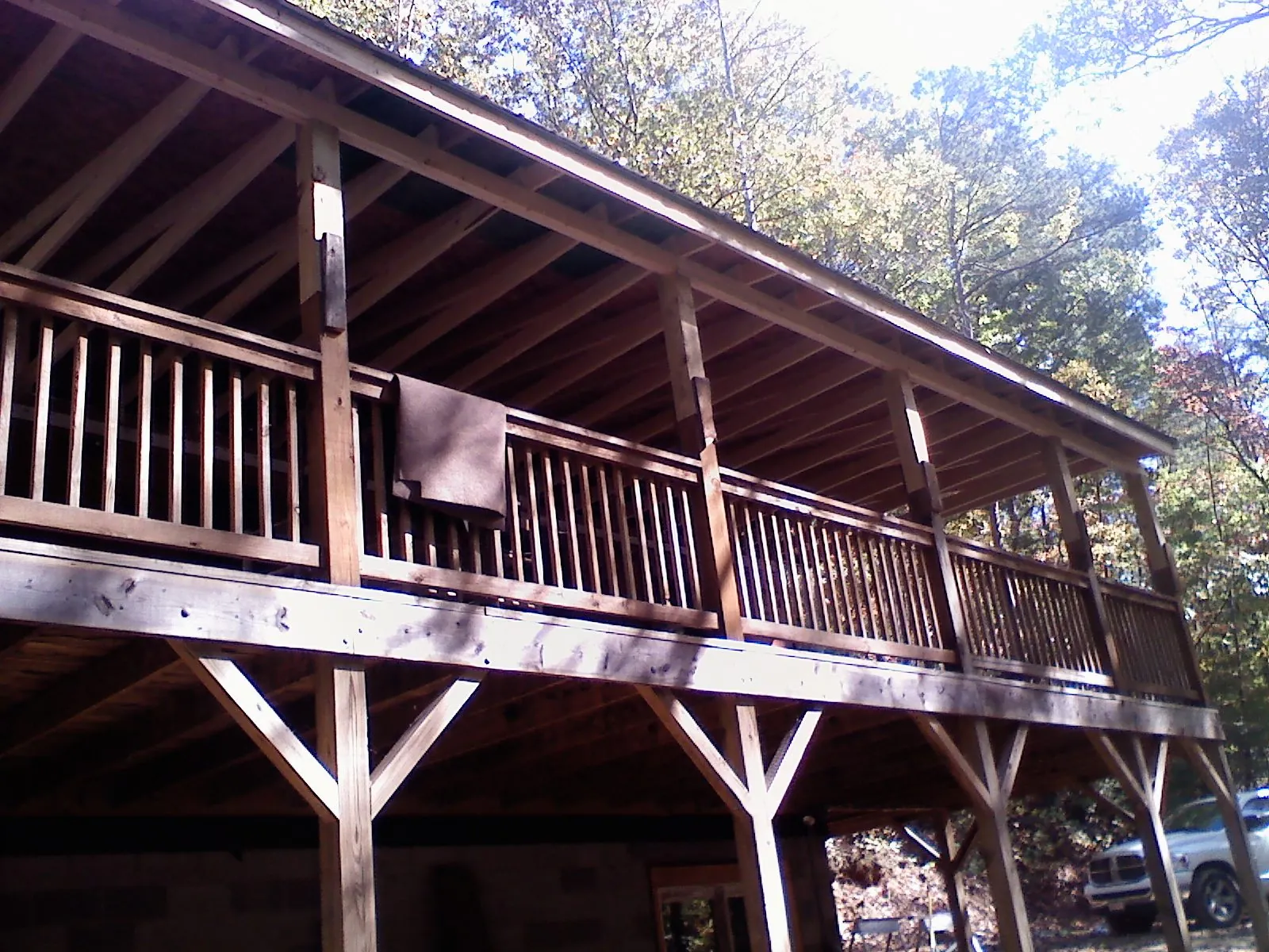 Timber framing under a new elevated porch and deck — Roof Leak Repair in Newport Beach by Roofing Brothers